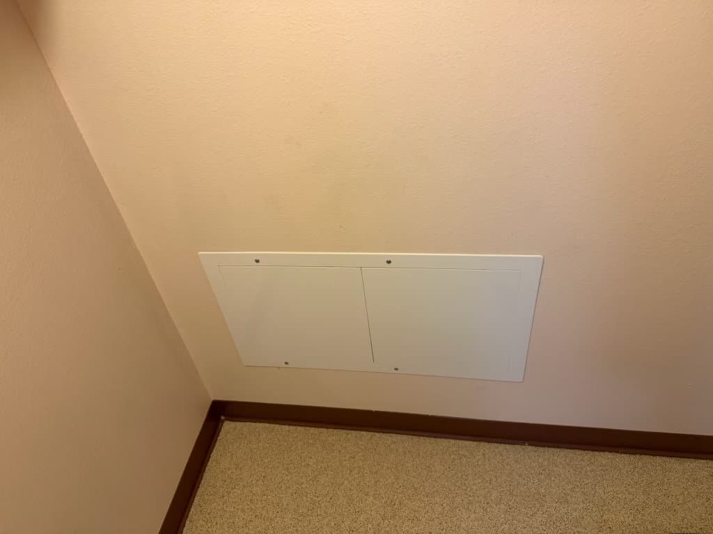 After: completed access panel installation, clean flush finish in drywall — Northern Colorado plumbing repair