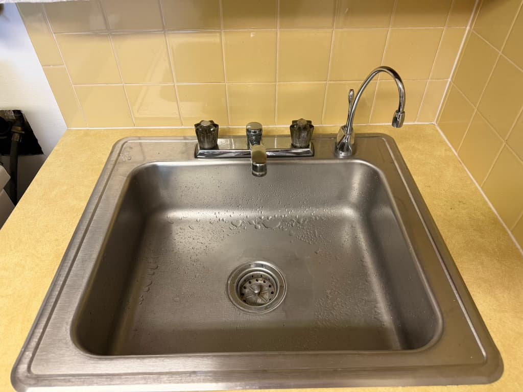 After: new kitchen faucet installed and fully operational — Oopsie Daisy Plumbing fixture installation Northern Colorado